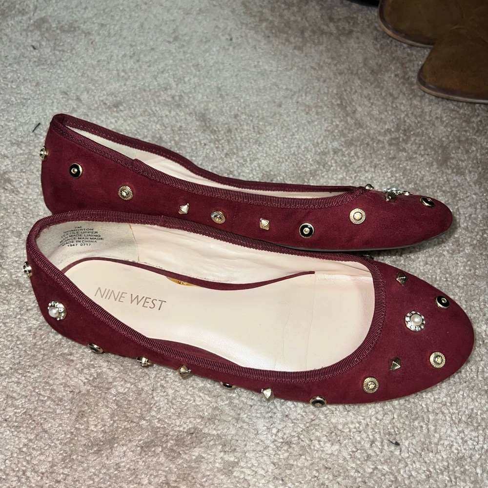 Nine West burgundy flats with fun gold details